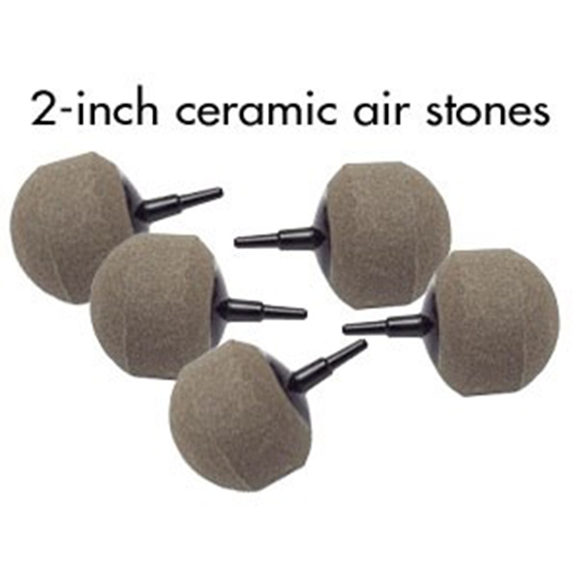 A set of five ceramic air stones with black handles.